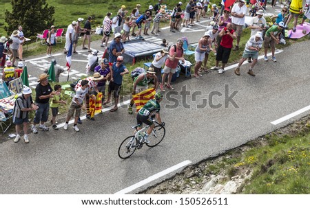 PORT DE PAILHERES,FRANCE- JUL 6:Supporters cheering the French cyclist Cyril Gautier from Team Europcar climbing the road to Col de Pailheres during the stage 8 of  Le Tour de France on 6 July 2013.