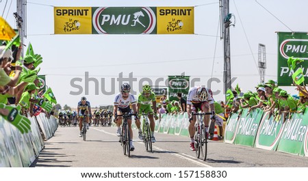SAINT AOUSTRILLE,FRANCE- JUL 12: Andre Greipel wins against Mark Cavendish and Peter Sagan the intermediate sprint during the stage 13 of Le Tour de France 2013 in Saint-Aoustrille, France.