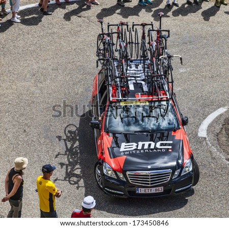 PORT DE PAILLERES,FRANCE- JUL 6:Technical car of BMC procycling team climbing the road to Col de Pailheres in Pyrenees Mountains during the stage 8 of Le Tour de France on July 6, 2013.