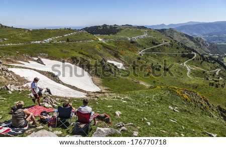 PORT DE PAILHERES,FRANCE- JUL 6:Cycling fans waiting for the peloton many hours before the race on the Col de Pailheres in Pyrenees Mountain during stage 8 of Le Tour de France on July 6 2013