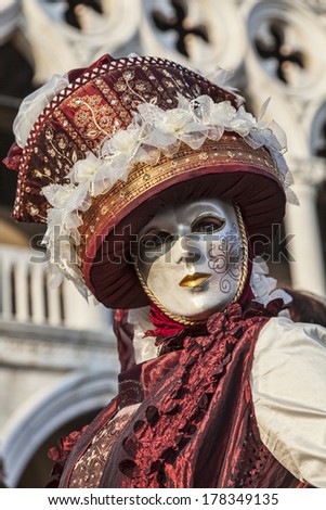 VENICE-FEB 18:Portrait of a person wearing a beautiful mask and disguise on February 18, 2012 in Venice.In 2014 the Venice Carnival is between February 15- March 4
