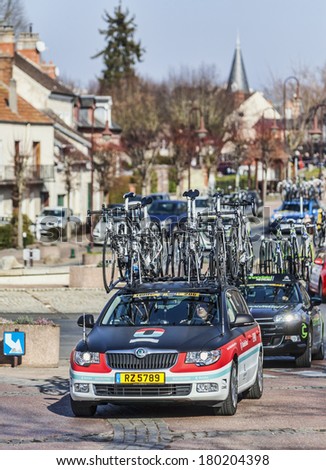 SAINT-PIERRE-LES-NEMOURS,FRANCE,MARCH 4: Row of technical teams cars during the first stage of the famous road bicycle race Paris-Nice, on March 4, 2013 in Saint-Pierre-les-Ne mours.