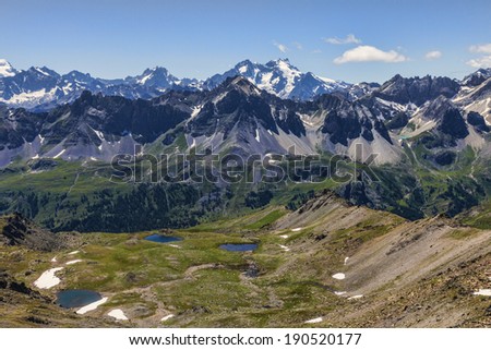 View of the Ecrins Massiff in the background with the small Lakes Gradioles in the first plane on Claree Valley in Haute Alpes, Nevache.