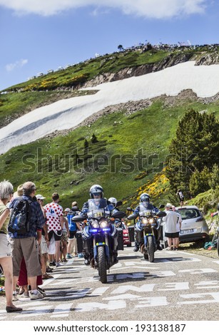 PORT DE PAILHERES,FRANCE- JUL 6:Group of Police\'s bikes driving on the road to the Col de Pailheres in the stage 8 Le Tour de France on 6 July 2013