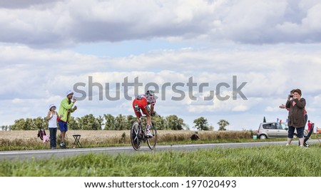 BEAUROUVRE,FRANCE,JUL 21:Image of the French cyclist Thomas Voeckler (Team Europcar) wearing The Polka-Dot Jersey during the 19 stage- a time trial between Bonneval and Chartres on July 21 2012.