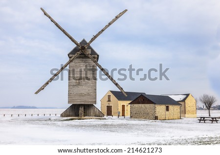 Traditional wooden windmill in the Eure&Loir region of France during the winter.This windmill is \