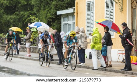 GERARDMER,FRANCE - JUL 12: Three cyclists, Tanel Kangert (Astana),Leopold Konig (NetApp-Endura) and Cyril Gautier (Europcar) ride during the stage 8 of Le Tour de France on July 12, 2014 in Gerardmer