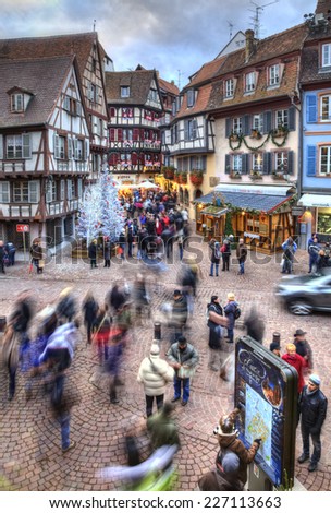 COLMAR,FRANCE-DEC 6:People walking in a square with traditional half-timber houses and Christmas decorations in Colmar, France on December 6, 2013.Colmar is the capital of Alsatian wine.
