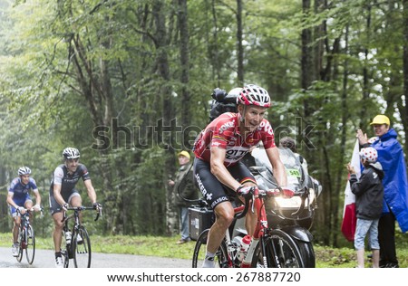 COL DU PLATZERWASEL,FRANCE - JUL 14: The cyclist Lars Bak of Lotto Belisol Team, climbing the mountain pass Platzerwasel in Vosges Mountains during the stage 10 of Le Tour de France on July 14 2014