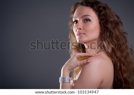 Head and shoulders portrait of beautiful woman with long hair