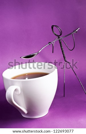 Wire character shoveling sugar into coffee cup