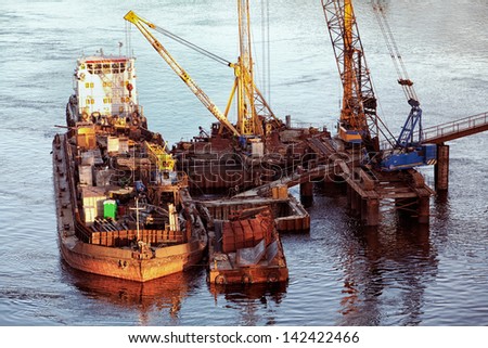 Bridge construction site with heavy machinery working