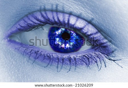 blue eye with blue sparks looking like snowflakes