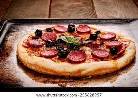 Pepperoni pizza on oven rack