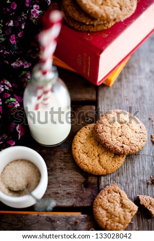 biscuits with milk, straw, and sugar bowl