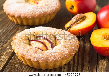 Homemade mini peach cake  on wooden background