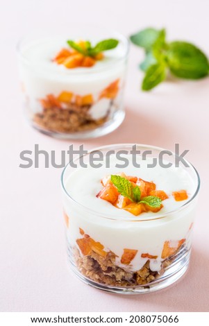 Peach trifle with crunchy toasted oats and dried fruit