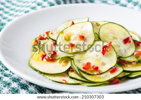Marinated zucchini salad on a white plate