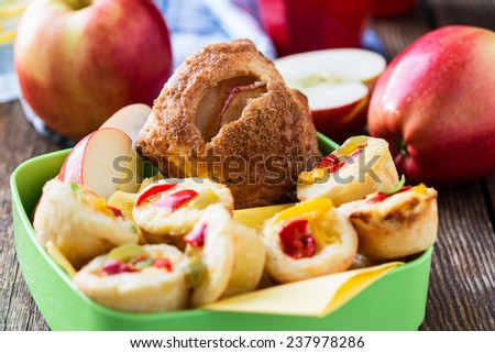 Mini apple cinnamon strudel and mini quiche in a  party food box, perfect food for picnic lunch with the kids
