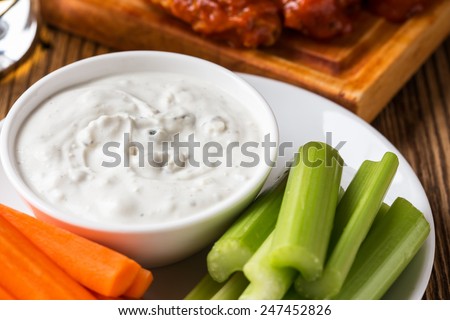 Blue cheese dressing, popular dip with buffalo wings and raw vegetables