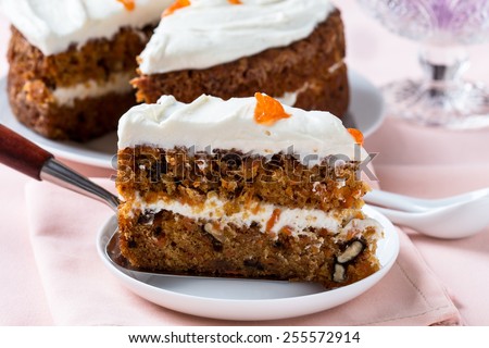 Mother\'s day carrot cake, homemade moist and sweet layer cake with grated carrot,  walnuts and dried apricot topped with swirls cream cheese frosting.  Delicious delight for holiday