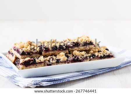 Homemade currant cornmeal crumble bars with streusel topping, healthy sweet dessert