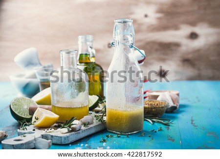 Homemade vinaigrette and ingredients, salad dressing with oil, vinegar and mustard, rustic style