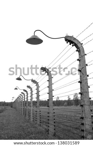 Wired fence around the concentration camp Birkenau (Auschwitz).