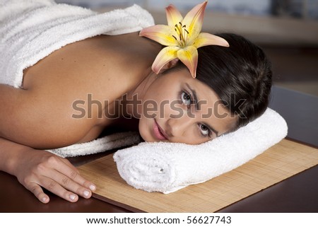 Beautiful young lady in spa salon