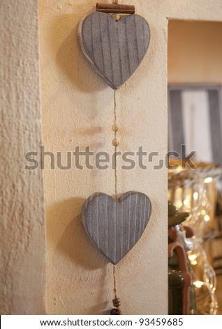 Two wooden hearts hanging on the wall
