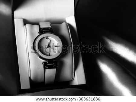 Black and white picture of watch, low key style selective focus