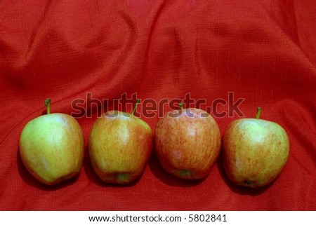 Four Apples on Red Cloth