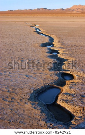 water puddles drying up on lakebed