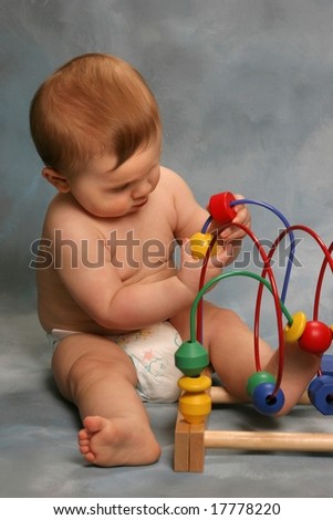 Baby playing with learning toy