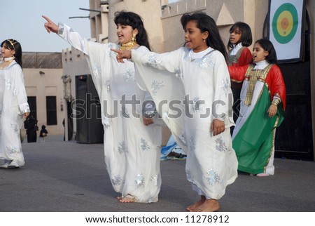 stock photo Young school girls at dubai annual festival