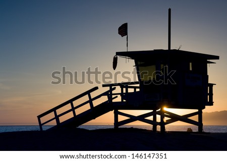 Sunset thru a lifeguard tower near Santa Monica in Los Angeles, USA