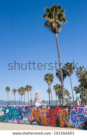 Los Angeles, Usa - April 12 - A Graffitied Wall And Palm Trees Near Venice Beach On April 12th 2008.