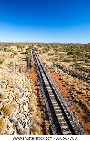 An iconic 3 trailer Australian road train travels along the Plenty Hwy near Gemtree in Northern Territory, Australia