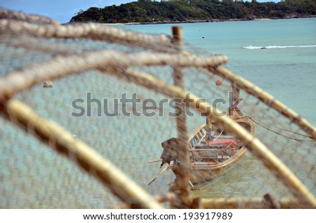 Bamboo fish trap and Fishing Boat at Rawai Beach of Phuket Thailand