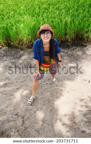 Thai women portrait at Paddy and rice field Background in Thailand