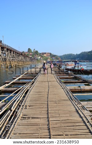KANCHANABBURI, THAILAND - FEBRUARY 2 : People go to travel Antique bamboo bridge use instead Saphan Mon wooden bridge at Sangkhlaburi on February 2, 2014 in Kanchanaburi, Thailand.