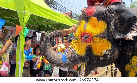AYUTTHAYA, THAILAND - APRIL 14 : Songkran Festival is celebrated in a traditional New Year\'s Day from April 13 to 15, with the splashing water with elephants on April 14, 2015 in Ayutthaya, Thailand.