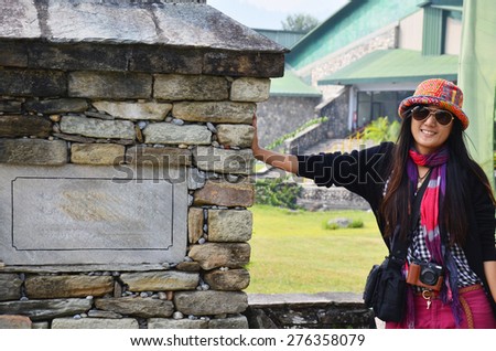 Traveler Thai Women portrait with tag of International Mountain Museum at Pokhara in Annapurna Valley Nepal