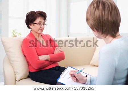 An elderly woman on reception at the psychologist