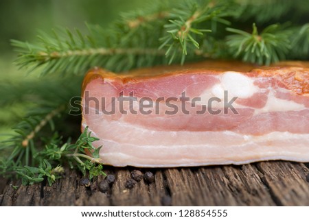 Cured meat on wooden ground