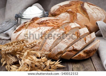 Fresh Bread On Wooden Ground