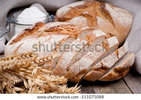 Fresh bread on wooden ground