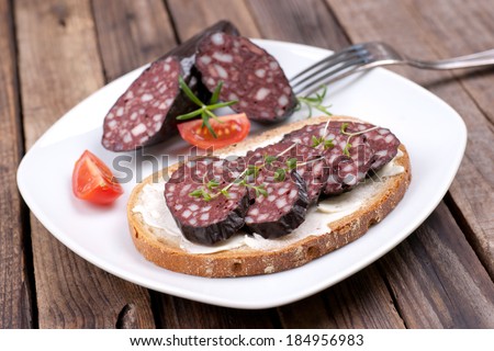 Fresh bread with black pudding