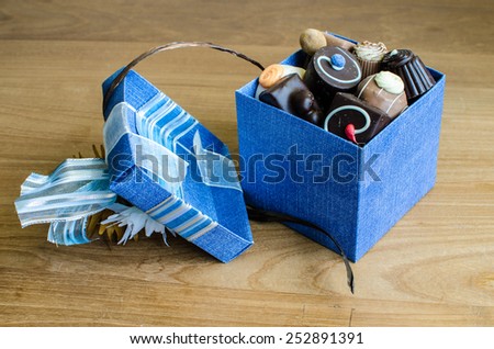 chocolates in blue box with corsage