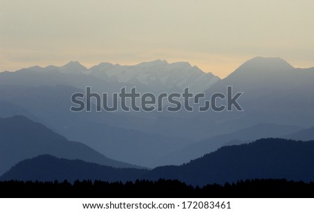 Blue gradient color over mountains silhouettes